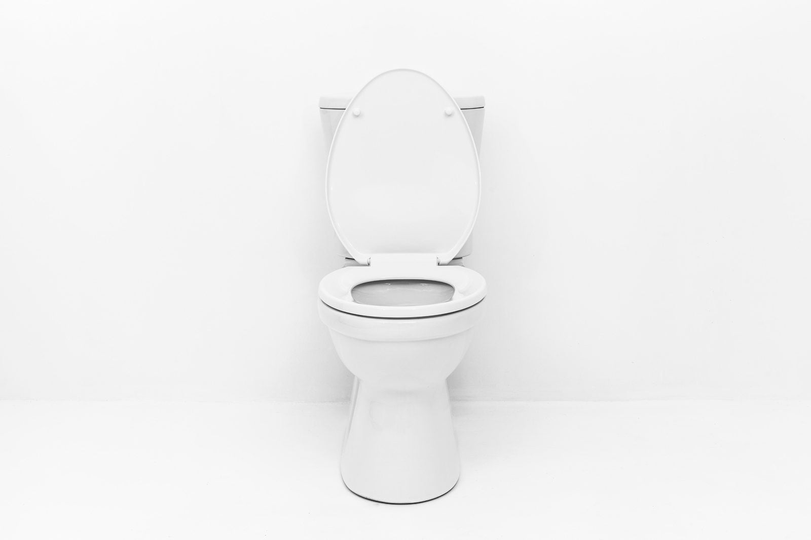 White porcelain toilet with the seat closed